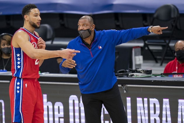Philadelphia 76ers head coach Doc Rivers, right, directs Ben Simmons, left, during the first half of an NBA basketball game against the Boston Celtics, Friday, Jan. 22, 2021, in Philadelphia. The 76ers won 122-110. (AP Photo/Chris Szagola)