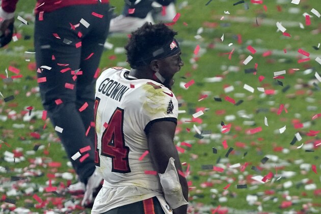 Tampa Bay Buccaneers wide receiver Chris Godwin (14) and tight end Tanner Hudson (88) celebrate after winning the NFL Super Bowl 55 football game against the Kansas City Chiefs Sunday, Feb. 7, 2021, in Tampa, Fla. (AP Photo/Jason Behnken)
