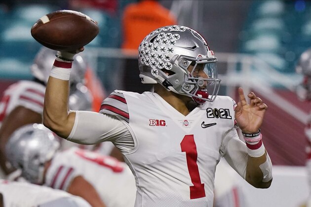 Ohio State quarterback Justin Fields warms up before an NCAA College Football Playoff national championship game against Alabama, Monday, Jan. 11, 2021, in Miami Gardens, Fla. (AP Photo/Lynne Sladky)