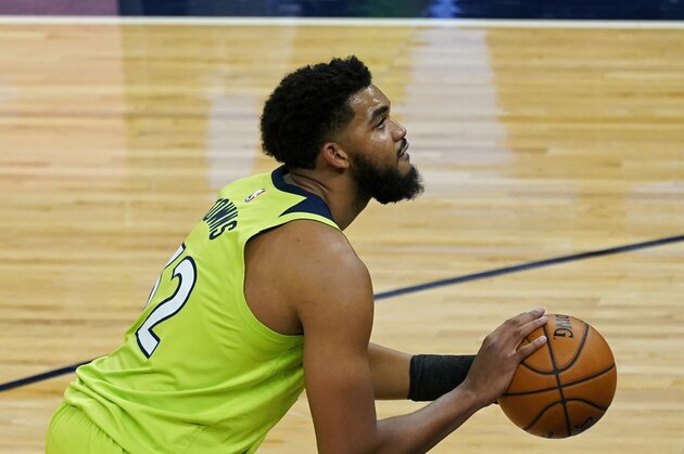 Minnesota Timberwolves' Karl-Anthony Towns (32) plays against the San Antonio Spurs in an NBA basketball game Saturday, Jan. 9, 2021, in Minneapolis. (AP Photo/Jim Mone)
