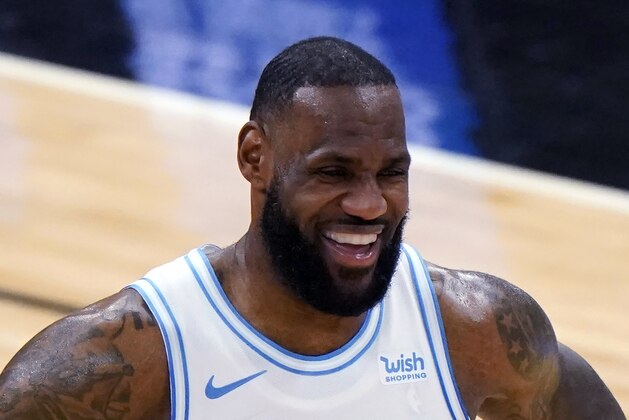 FILE - In this Jan. 23, 2021, file photo, Los Angeles Lakers forward LeBron James smiles during the second half of an NBA basketball game against the Chicago Bulls in Chicago. The Associated Press asked eight of the greatest current and former champions, including James, from seven different sports to find out what impressed them most about Tom Brady.(AP Photo/Nam Y. Huh)