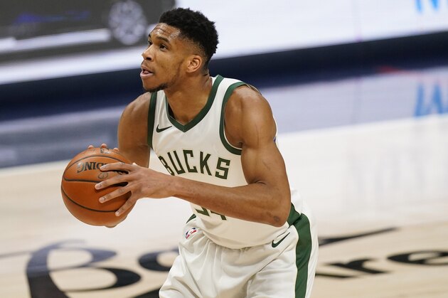 Milwaukee Bucks forward Giannis Antetokounmpo (34) in the first half of an NBA basketball game Monday, Feb. 8, 2021, in Denver. (AP Photo/David Zalubowski)