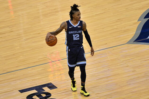 Memphis Grizzlies guard Ja Morant (12) plays in the first half of an NBA basketball game against the Charlotte Hornets Wednesday, Feb. 10, 2021, in Memphis, Tenn. (AP Photo/Brandon Dill)