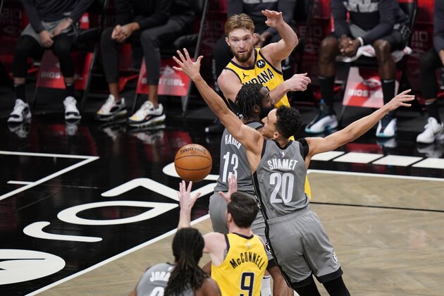 Indiana Pacers' Domantas Sabonis, above, passes to teammate T.J. McConnell, below, during the second half of an NBA basketball game as Brooklyn Nets' James Harden and Landry Shamet, right, defend Wednesday, Feb. 10, 2021, in New York. (AP Photo/Frank Franklin II)
