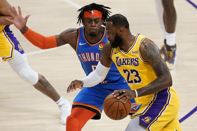 Oklahoma City Thunder forward Luguentz Dort defends against Los Angeles Lakers forward LeBron James (23) during the second quarter of an NBA basketball game Wednesday, Feb. 10, 2021, in Los Angeles. (AP Photo/Ashley Landis)