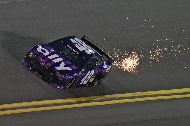 Driver Alex Bowman (48) kicks up sparks as he runs during a NASCAR Daytona 500 qualifying session Wednesday, Feb. 10, 2021, at Daytona International Speedway in Daytona Beach, Fla. Bowman took the pole position for Sunday running of the race. (AP Photo/Chris O'Meara)