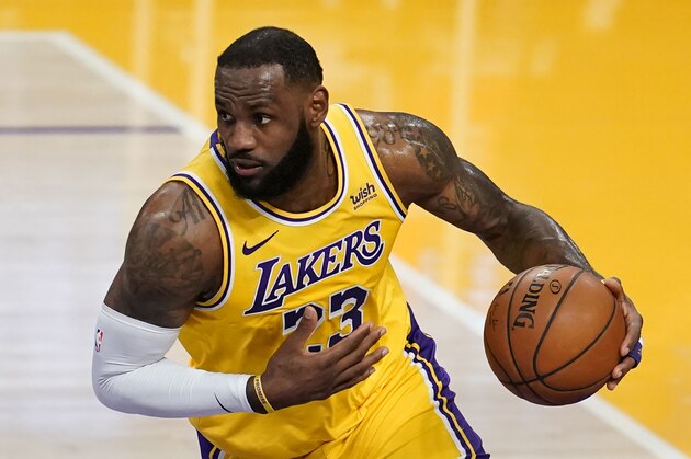 Los Angeles Lakers forward LeBron James dribbles against the Detroit Pistons during an NBA basketball game Saturday, Feb. 6, 2021, in Los Angeles. (AP Photo/Marcio Jose Sanchez)