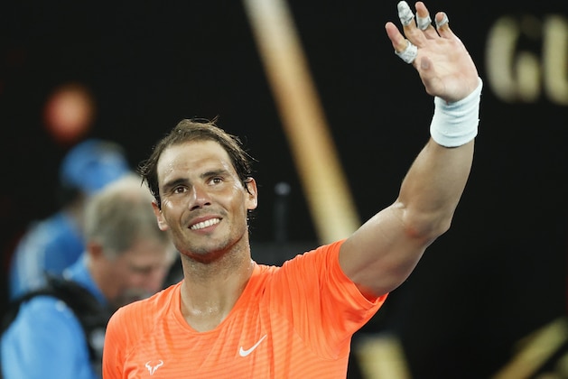 Spain's Rafael Nadal celebrates after defeating United States' Michael Mmoh during their second round match at the Australian Open tennis championship in Melbourne, Australia, Thursday, Feb. 11, 2021.(AP Photo/Rick Rycroft)