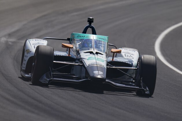 Fernando Alonso, of Spain, drives through the third turn during qualifying for the Indianapolis 500 auto race at Indianapolis Motor Speedway in Indianapolis, Saturday, Aug. 15, 2020. (AP Photo/Michael Conroy)