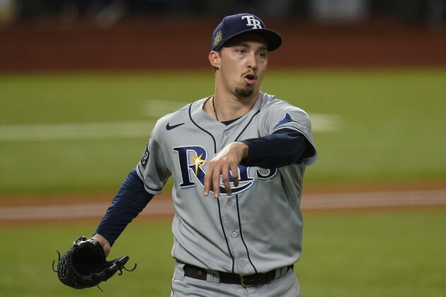 FILE - Tampa Bay Rays starting pitcher Blake Snell celebrates the end of the fifth inning against the Los Angeles Dodgers in Game 6 of the baseball World Series in Arlington, Texas, in this Tuesday, Oct. 27, 2020, file photo. With baseball trying to negotiate a comeback and unemployment battering the country, star Tampa Bay pitcher Blake Snell took a less than diplomatic approach: “I’m not splitting no revenue,” he said. “I want all mine.” (AP Photo/Eric Gay, File)