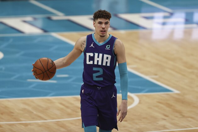 Charlotte Hornets guard LaMelo Ball brings the ball up court against the Houston Rockets in the second half of an NBA basketball game in Charlotte, N.C., Monday, Feb. 8, 2021. Charlotte won 119-94. (AP Photo/Nell Redmond)