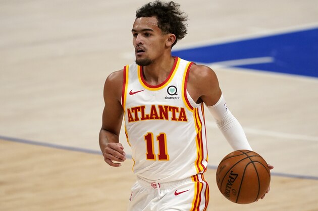 Atlanta Hawks' Trae Young (11) handles the ball during an NBA basketball game against the Dallas Mavericks in Dallas, Wednesday, Feb. 10, 2021. (AP Photo/Tony Gutierrez)