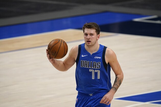 Dallas Mavericks' Luka Doncic handles the ball during an NBA basketball game against the Atlanta Hawks in Dallas, Wednesday, Feb. 10, 2021. (AP Photo/Tony Gutierrez)