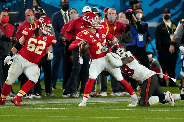 Kansas City Chiefs QB Pat Mahomes (15) attempts to get off a pass while being pressured by Tampa Bay Buccaneers Shaquil Barrett (58) during the NFL Super Bowl LV football game on Sunday. Feb. 7, 2021, in Tampa, Fla. (AP Photo/Doug Benc)