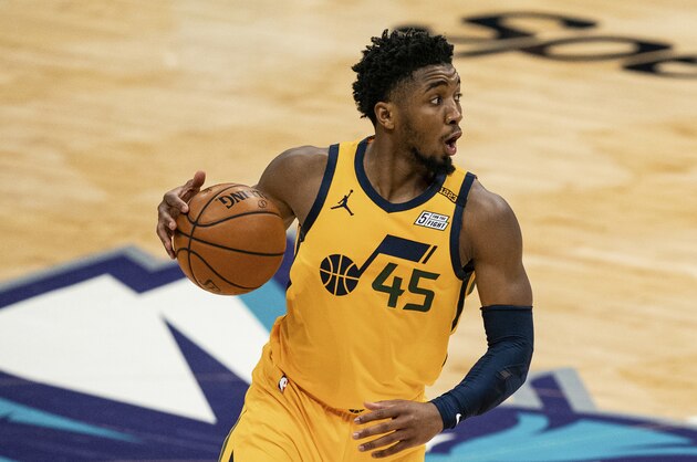 Utah Jazz guard Donovan Mitchell (45) brings the ball up court against the Charlotte Hornets during an NBA basketball game in Charlotte, N.C., Friday, Feb. 5, 2021. (AP Photo/Jacob Kupferman)
