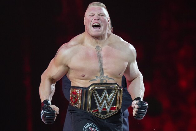 FILE - In this March 29, 2015, file photo, Brock Lesnar makes his entrance at Wrestlemania XXXI in Santa Clara, Calif. UFC 200 has grown so big that a single show can’t contain it. The mixed martial arts promotion is throwing an “International Fight Week” in Las Vegas with compelling shows on three consecutive nights, culminating in the star-studded pay-per-view event Saturday. Jon Jones meets light heavyweight champion Daniel Cormier in the main event of a card also featuring the return of former heavyweight champ Brock Lesnar. (AP Photo/Don Feria, File)