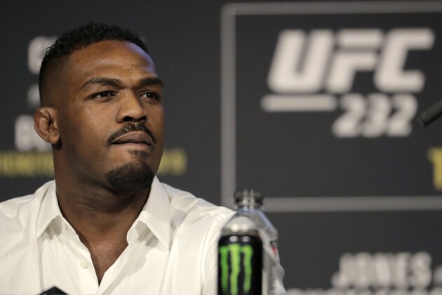 FILE - In this Nov. 2, 2018, file photo, Jon Jones talks in New York about his mixed martial arts light heavyweight bout against Alexander Gustafsson at UFC 232. Jones is defiantly defending his role in the decision to move UFC 232 from Nevada to California on six days’ notice after he tested positive for low levels of a banned steroid. The former light heavyweight champion gave a passionate, occasionally bizarre performance Thursday at a news conference ahead of his title fight against Sweden’s Alexander Gustafsson at the Forum in Inglewood, Calif., on Saturday night. (AP Photo/Julio Cortez, File) FILE - In this Nov. 2, 2018, file photo, Jon Jones talks in New York about his mixed martial arts light heavyweight bout against Alexander Gustafsson at UFC 232. Jones is defiantly defending his role in the decision to move UFC 232 from Nevada to California on six days’ notice after he tested positive for low levels of a banned steroid. The former light heavyweight champion gave a passionate, occasionally bizarre performance Thursday at a news conference ahead of his title fight against Sweden’s Alexander Gustafsson at the Forum in Inglewood, Calif., on Saturday night. (AP Photo/Julio Cortez, File)