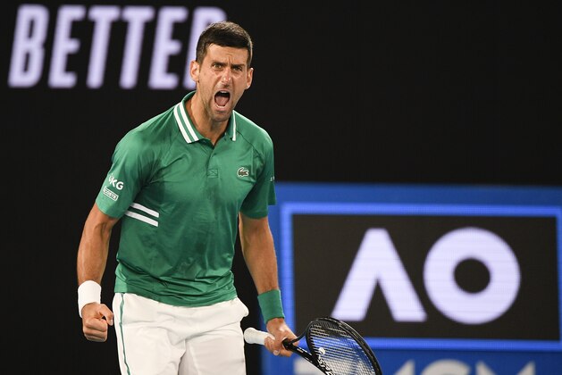 Serbia's Novak Djokovic celebrates after defeating United States' Talyor Fritz in their third round match at the Australian Open tennis championship in Melbourne, Australia, Saturday, Feb. 13, 2021.(AP Photo/Andy Brownbill)