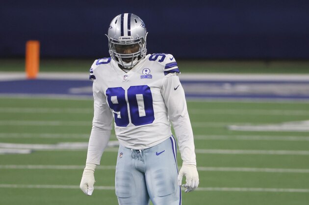 Dallas Cowboys defensive end DeMarcus Lawrence (90) waits between plays as the Cowboys play the Arizona Cardinals during an NFL football game in Arlington, Texas, Sunday, Oct. 19, 2020. (AP Photo/Ron Jenkins)