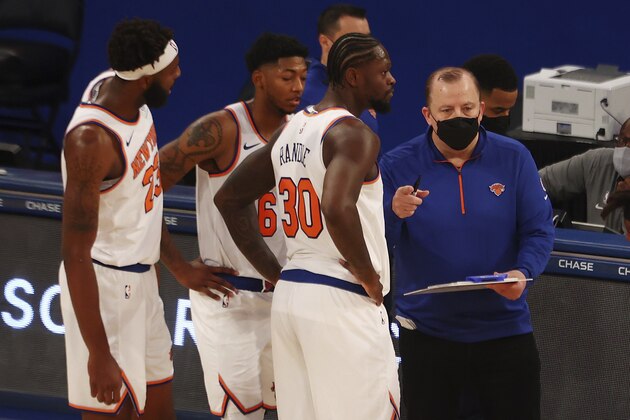 New York Knicks head coach Tom Thibodeau, right, speaks with Julius Randle (30) during an NBA basketball game against the Miami Heat at Madison Square Garden in New York, Sunday, Feb. 7, 2021. (Mike Stobe/Pool Photo via AP)