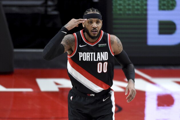 Portland Trail Blazers forward Carmelo Anthony reacts after hitting a three point shot during the first half of an NBA basketball game against the Orlando Magic in Portland, Ore., Tuesday, Feb. 9, 2021. (AP Photo/Steve Dykes)