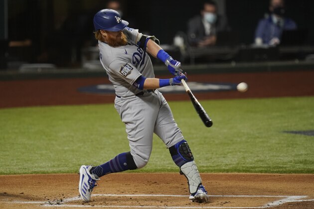 Los Angeles Dodgers' Justin Turner his a home run against the Tampa Bay Rays during the first inning in Game 4 of the baseball World Series Saturday, Oct. 24, 2020, in Arlington, Texas. (AP Photo/Eric Gay)