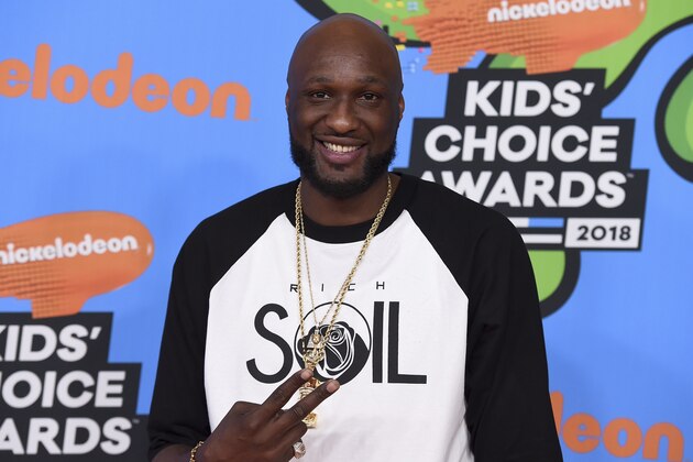 FILE - In this March 24, 2018 file photo, Lamar Odom arrives at the Kids' Choice Awards at The Forum in Inglewood, Calif. Odom regrets cheating on ex Khloé Kardashian and lying to her about his addiction to cocaine during their four-year marriage. The 39-year-old tells People magazine he wishes he “could have been more of a man” and it still bothers him three years after they divorced.  (Photo by Jordan Strauss/Invision/AP, File)