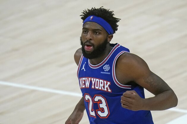 New York Knicks center Mitchell Robinson (23) defends in the second half during an NBA basketball game against the Utah Jazz Tuesday, Jan. 26, 2021, in Salt Lake City. (AP Photo/Rick Bowmer)