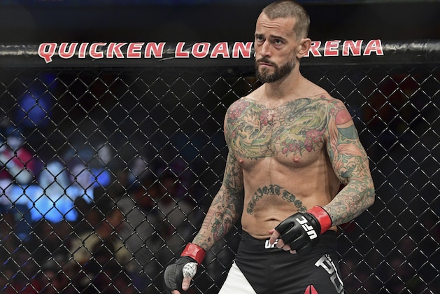 FILE - In this Saturday, Sept. 10, 2016 file photo, CM Punk stands in his corner before a welterweight bout at UFC 203 in Cleveland.  CM Punk won the fight of his life this week when he was cleared by a jury of defamation and invasion of privacy in a lawsuit brought by a wrestling doctor. But he still has a big one ahead when he fights at UFC 225 in Chicago. (AP Photo/David Dermer, File)