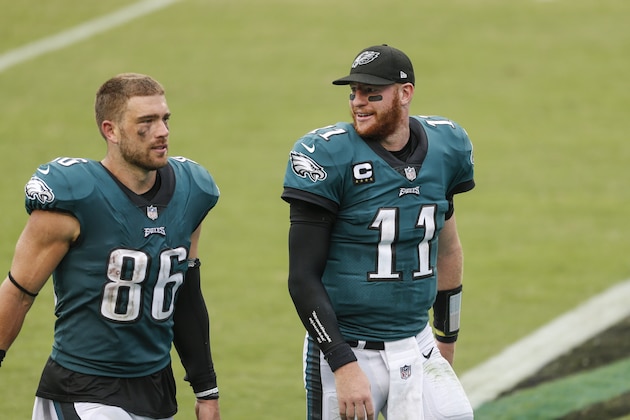 Philadelphia Eagles quarterback Carson Wentz (11) and tight end Zach Ertz (86) walk off the field after an NFL football game against the Cincinnati Bengals, Sunday, Sept. 27, 2020, in Philadelphia. (AP Photo/Laurence Kesterson)