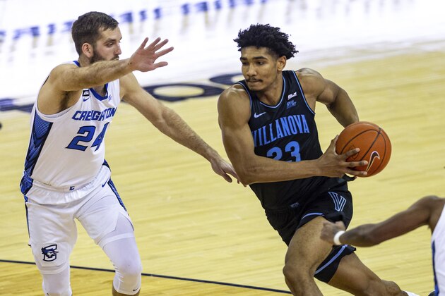 Villanova forward Jermaine Samuels (23) drives to the basket against Creighton guard Mitch Ballock (24) in the first half during an NCAA college basketball game Saturday, Feb. 13, 2021, in Omaha, Neb. (AP Photo/John Peterson)