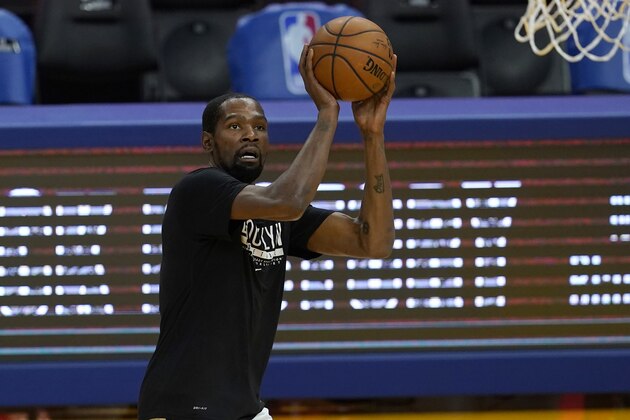 Brooklyn Nets forward Kevin Durant warms up before an NBA basketball game against the Golden State Warriors in San Francisco, Saturday, Feb. 13, 2021. (AP Photo/Jeff Chiu)