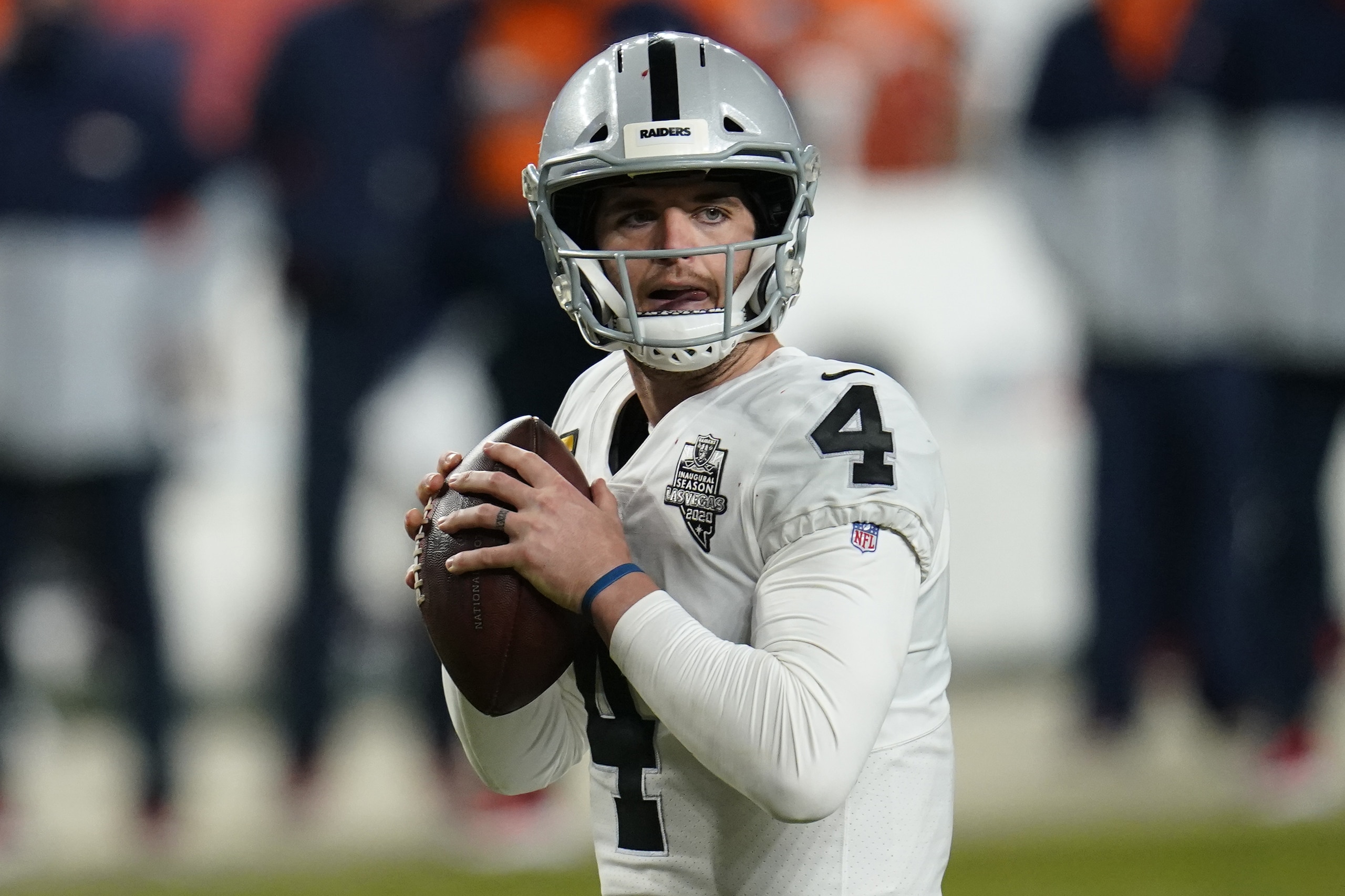 Las Vegas Raiders quarterback Derek Carr (4) looks to throw against the Denver Broncos during the second half of an NFL football game, Sunday, Jan. 3, 2021, in Denver. (AP Photo/David Zalubowski)
