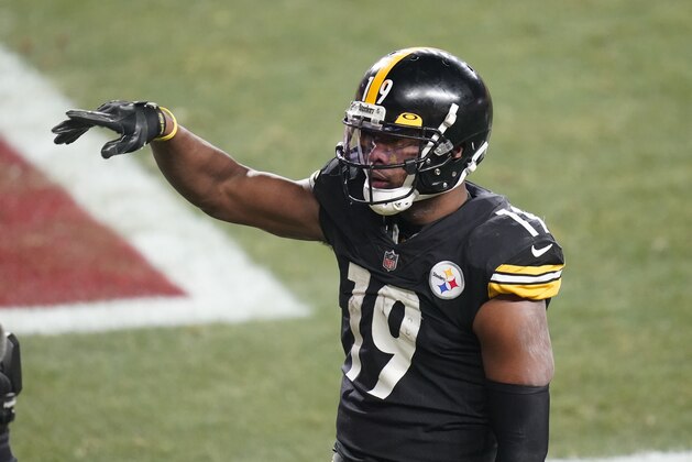 Pittsburgh Steelers wide receiver JuJu Smith-Schuster (19) celebrates after scoring on a 5-yard pass from quarterback Ben Roethlisberger during the second half of an NFL wild-card playoff football game against the Cleveland Browns, Sunday, Jan. 10, 2021, in Pittsburgh. (AP Photo/Keith Srakocic)