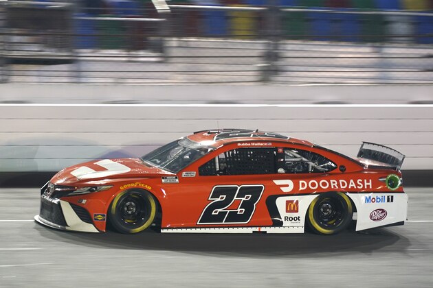 Bubba Wallace (23) races during the second of two qualifying NASCAR auto races for the Daytona 500 at Daytona International Speedway, Thursday, Feb. 11, 2021, in Daytona Beach, Fla. (AP Photo/John Raoux)