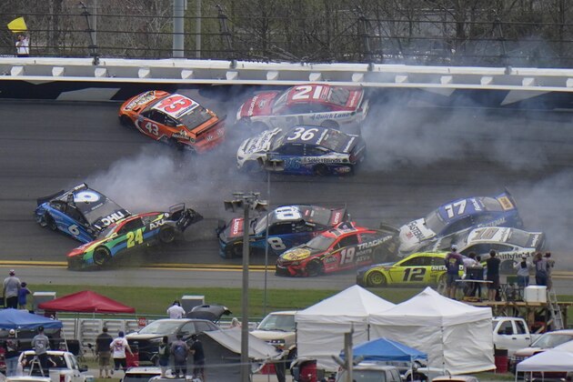 Cars collide in 13th lap during the NASCAR Daytona 500 auto race at Daytona International Speedway, Sunday, Feb. 14, 2021, in Daytona Beach, Fla. (AP Photo/Chris O'Meara)