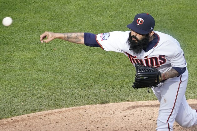 Minnesota Twins pitcher Sergio Romo throws against the Houston Astros in an American League playoff baseball game, Tuesday Sept. 29, 2020, in Minneapolis. (AP Photo/Jim Mone)