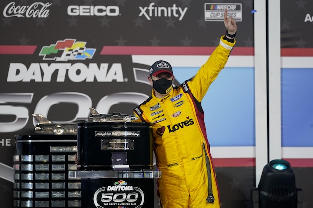 Michael McDowell celebrates after winning the NASCAR Daytona 500 auto race at Daytona International Speedway, Monday, Feb. 15, 2021, in Daytona Beach, Fla. (AP Photo/John Raoux)