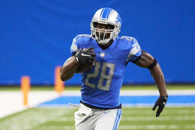 Detroit Lions running back Adrian Peterson (28) rushes against the Minnesota Vikings during an NFL football game, Saturday, Jan. 3, 2021, in Detroit. (AP Photo/Rick Osentoski)