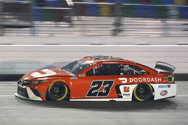 Bubba Wallace (23) races during the second of two qualifying NASCAR auto races for the Daytona 500 at Daytona International Speedway, Thursday, Feb. 11, 2021, in Daytona Beach, Fla. (AP Photo/John Raoux)