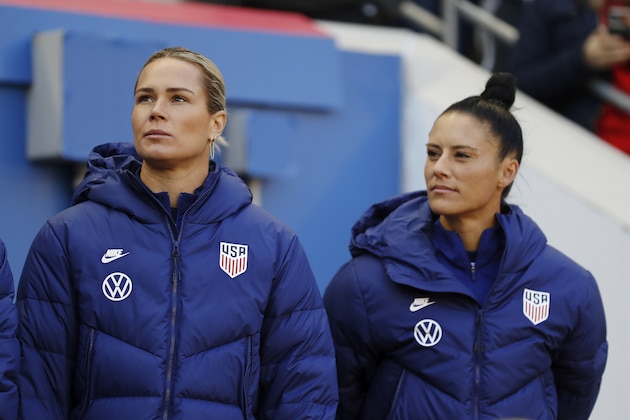 United States goalkeeper Ashlyn Harris, left, and United States defender Ali Krieger look out from the bench before the first half of a SheBelieves Cup soccer match against Spain Sunday, March 8, 2020, in Harrison, N.J. The United States won 1-0. (AP Photo/Steve Luciano) United States goalkeeper Ashlyn Harris, left, and United States defender Ali Krieger look out from the bench before the first half of a SheBelieves Cup soccer match against Spain Sunday, March 8, 2020, in Harrison, N.J. The United States won 1-0. (AP Photo/Steve Luciano)
