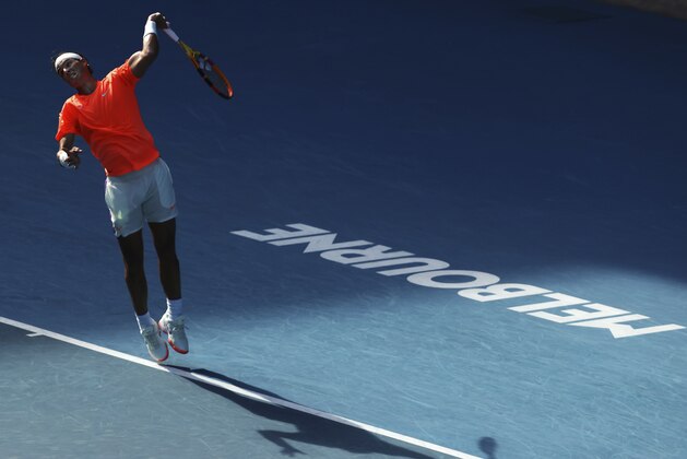 Spain's Rafael Nadal serves to Italy's Fabio Fognini during their fourth round match at the Australian Open tennis championships in Melbourne, Australia, Monday, Feb. 15, 2021. (AP Photo/Hamish Blair)