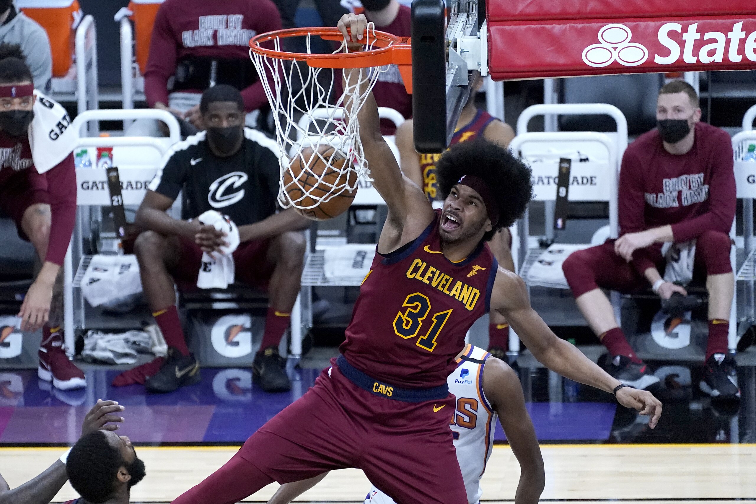 Cleveland Cavaliers center Jarrett Allen (31) dunks against the Phoenix Suns during the first half of an NBA basketball game, Monday, Feb. 8, 2021, in Phoenix. (AP Photo/Matt York)