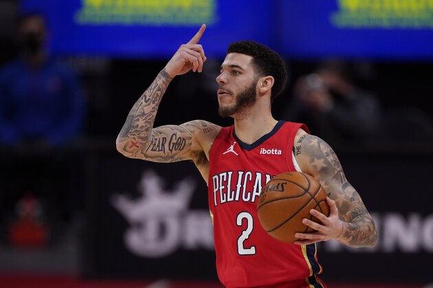 New Orleans Pelicans guard Lonzo Ball controls the ball during the first half of an NBA basketball game against the Detroit Pistons, Sunday, Feb. 14, 2021, in Detroit. (AP Photo/Carlos Osorio)