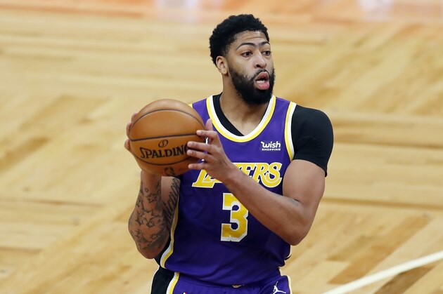 Los Angeles Lakers' Anthony Davis plays against the Boston Celtics during the first half of an NBA basketball game, Saturday, Jan. 30, 2021, in Boston. (AP Photo/Michael Dwyer)