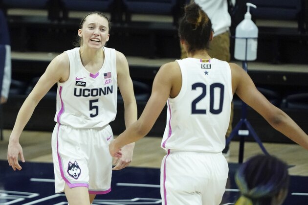 Connecticut guard Paige Bueckers (5) reacts after her three-point basket against South Carolina in overtime of an NCAA college basketball game in Storrs, Conn., Monday, Feb. 8, 2021. (David Butler/Pool Photo via AP)