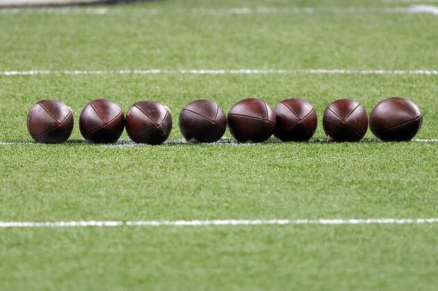 Footballs are seen on the field before an NFL wild-card playoff football game between the New Orleans Saints and the Chicago Bears, Sunday, Jan. 10, 2021, in New Orleans. The Saints defeated the Bears 21-9. (AP Photo/Tyler Kaufman)