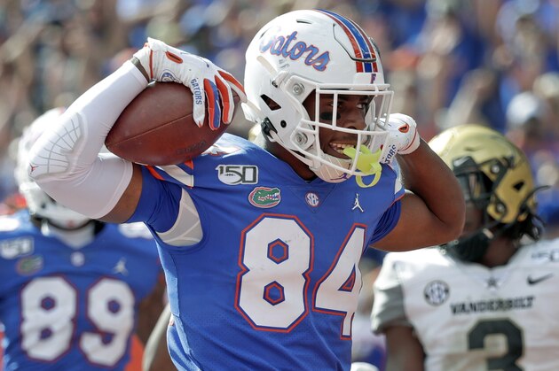 FILE - In this Nov. 9, 2019, file photo, Florida tight end Kyle Pitts (84) celebrates after scoring a touchdown on a 15-yard pass reception during the second half of an NCAA college football game against Vanderbilt, in Gainesville, Fla. Pitts was selected to The Associated Press All-Southeastern Conference football team, Monday, Dec. 9, 2019.(AP Photo/John Raoux, File)