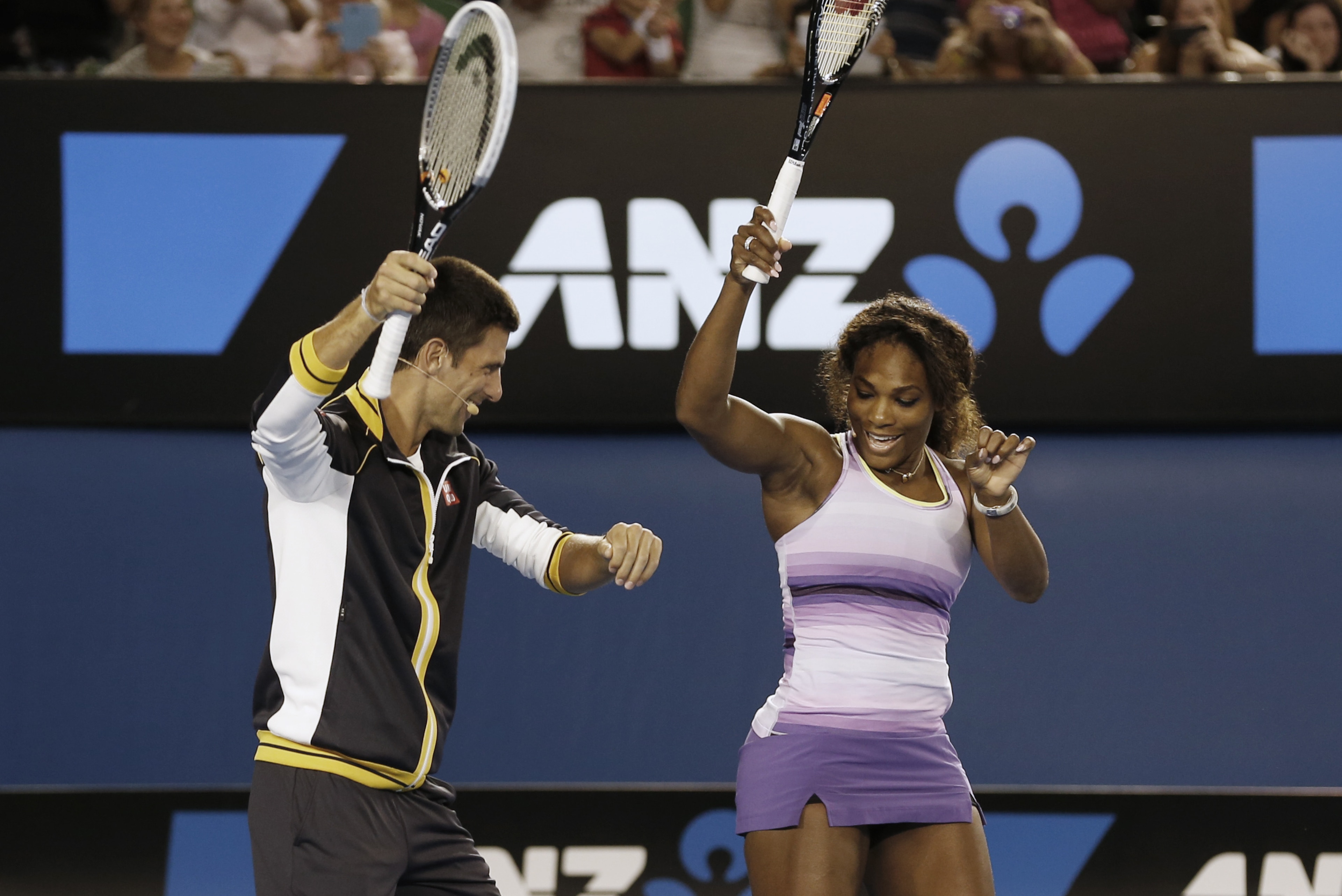 Serbia's Novak Djokovic and Serena Williams of the US perform the gangnam style dance during the Kids Tennis Day at Melbourne Park ahead of the Australian Open tennis championship in Melbourne, Australia, Saturday, Jan. 12, 2013. (AP Photo/Andy Wong)