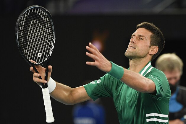 Serbia's Novak Djokovic reacts after defeating Germany's Alexander Zverev in their quarterfinal match at the Australian Open tennis championship in Melbourne, Australia, Wednesday, Feb. 17, 2021.(AP Photo/Andy Brownbill)